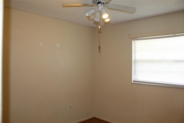 5177 Edwina St, Orlando, FL 32811 - empty room featuring a textured ceiling and a ceiling fan