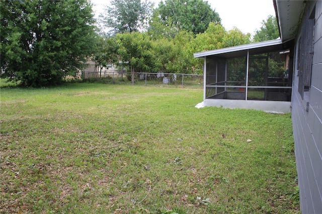 5177 Edwina St, Orlando, FL 32811 - view of yard with a sunroom and fence
