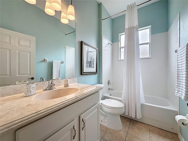 bathroom featuring tile patterned floors, toilet, vanity, and shower / bath combo