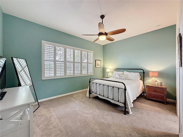 bedroom featuring carpet, baseboards, and ceiling fan