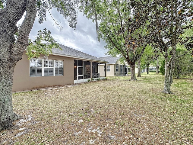 view of yard featuring a sunroom