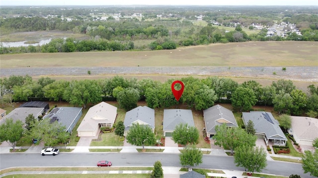 birds eye view of property with a residential view