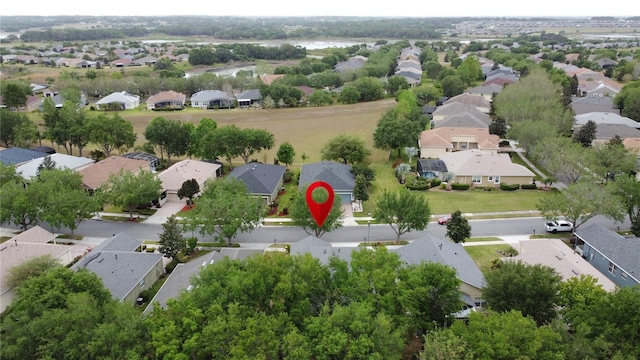 birds eye view of property with a residential view