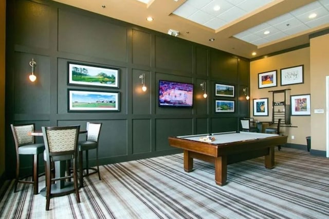 game room featuring carpet flooring, pool table, and a decorative wall