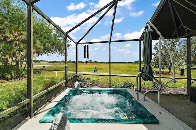 view of swimming pool with a lawn, a hot tub, and a lanai