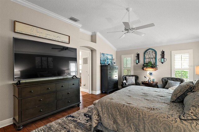 bedroom featuring dark wood-style floors, visible vents, multiple windows, and ornamental molding