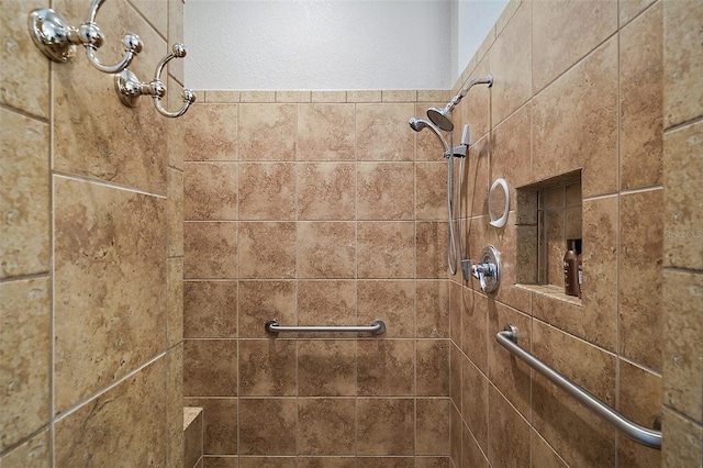 full bathroom with tiled shower