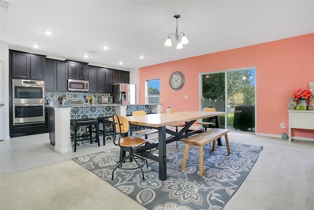161 Williamson Dr, Davenport, FL 33897 - dining area with light colored carpet, visible vents, recessed lighting, a chandelier, and baseboards