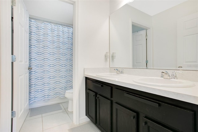 161 Williamson Dr, Davenport, FL 33897 - bathroom with toilet, tile patterned floors, double vanity, and a sink