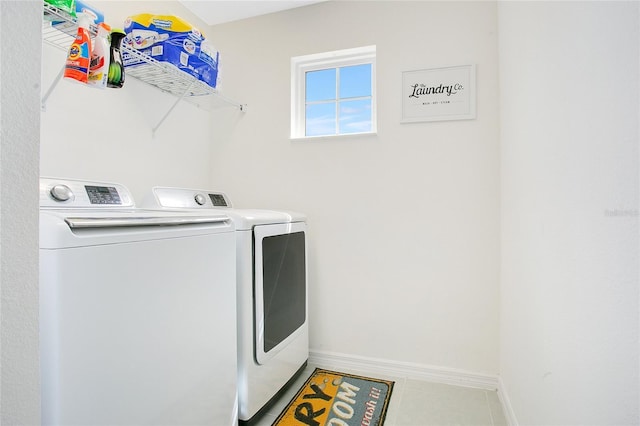 161 Williamson Dr, Davenport, FL 33897 - laundry room featuring tile patterned floors, laundry area, baseboards, and washer and dryer