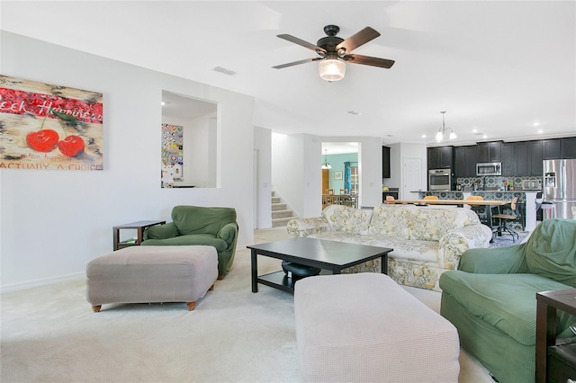 161 Williamson Dr, Davenport, FL 33897 - living area with recessed lighting, stairway, visible vents, ceiling fan, and light carpet
