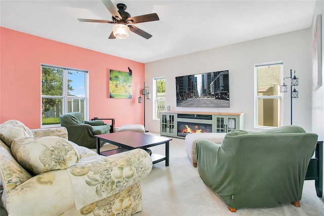 161 Williamson Dr, Davenport, FL 33897 - living area featuring ceiling fan, carpet, and a glass covered fireplace