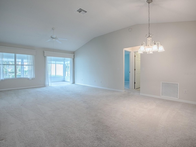 spare room featuring light carpet, ceiling fan with notable chandelier, and visible vents