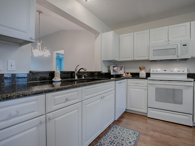 kitchen featuring a sink, white cabinetry, hanging light fixtures, white appliances, and light wood-style floors