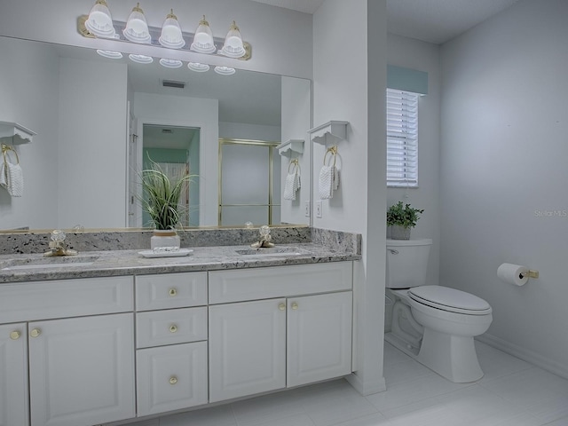 bathroom with visible vents, a sink, toilet, and a shower stall