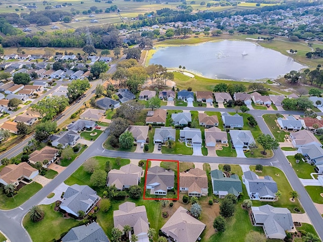 birds eye view of property with a water view and a residential view