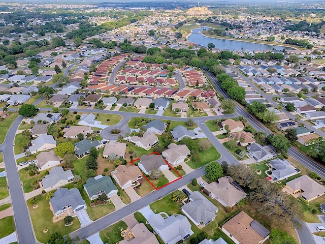 bird's eye view with a residential view and a water view