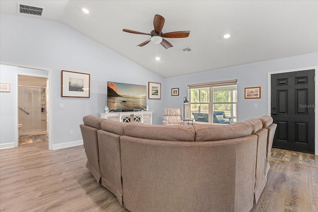 living area with visible vents, light wood-type flooring, and a ceiling fan
