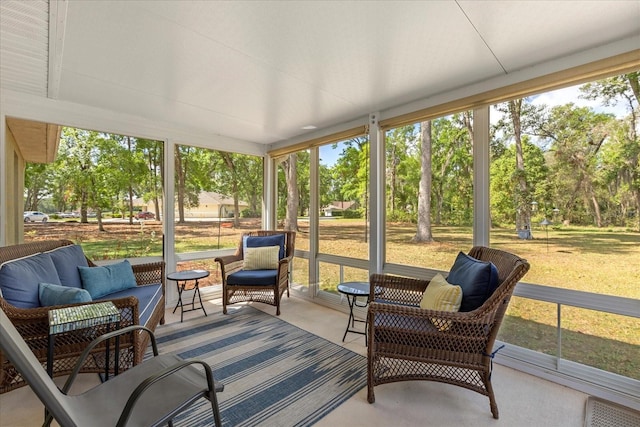 sunroom featuring an outdoor living space
