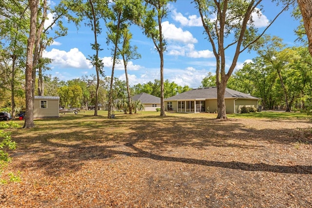 view of yard with an outdoor structure