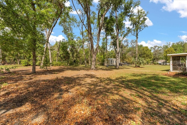 view of yard with a sunroom