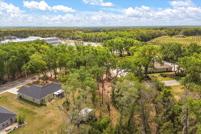 drone / aerial view featuring a view of trees
