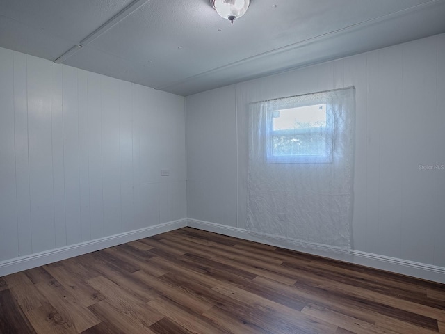 8901 SE 144th Ln, Summerfield, FL 34491 - unfurnished room with baseboards and dark wood finished floors