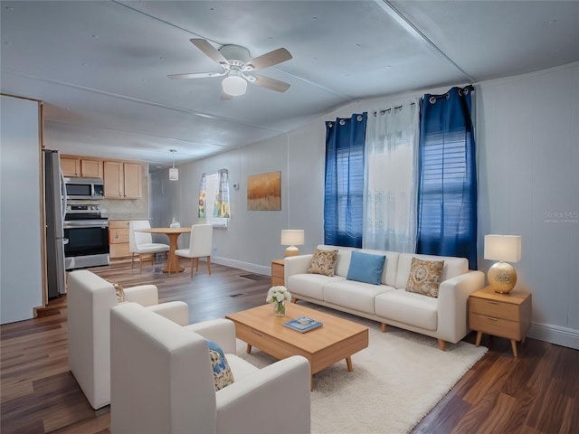 8901 SE 144th Ln, Summerfield, FL 34491 - living room with wood finished floors, lofted ceiling, baseboards, and ceiling fan