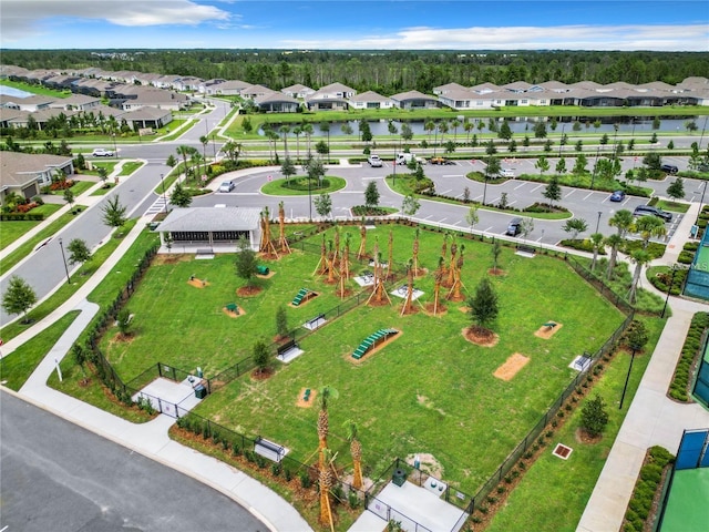 birds eye view of property with a residential view and a water view