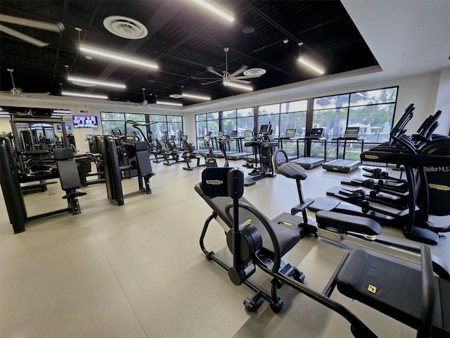 exercise room with a healthy amount of sunlight and visible vents