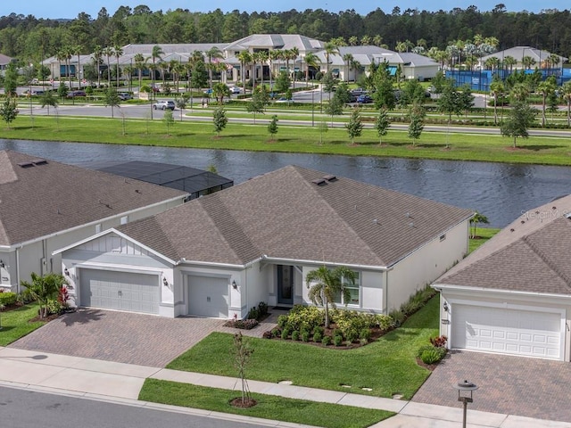 drone / aerial view featuring a water view and a residential view