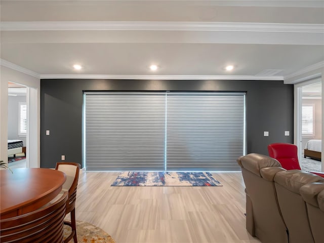 living room with recessed lighting, a healthy amount of sunlight, and crown molding