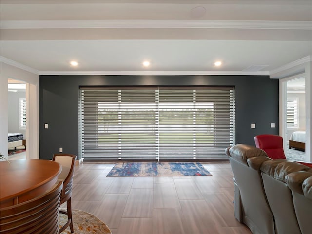 living area with crown molding, recessed lighting, and wood finished floors