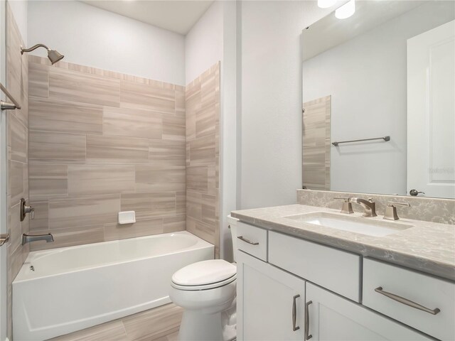 full bathroom with toilet, vanity, and shower / bathing tub combination