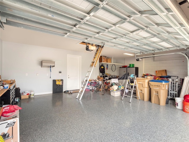 garage with baseboards and a garage door opener