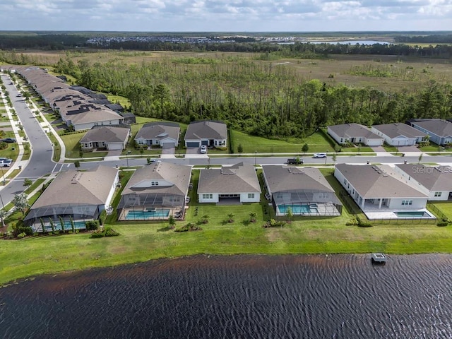 bird's eye view with a residential view and a water view