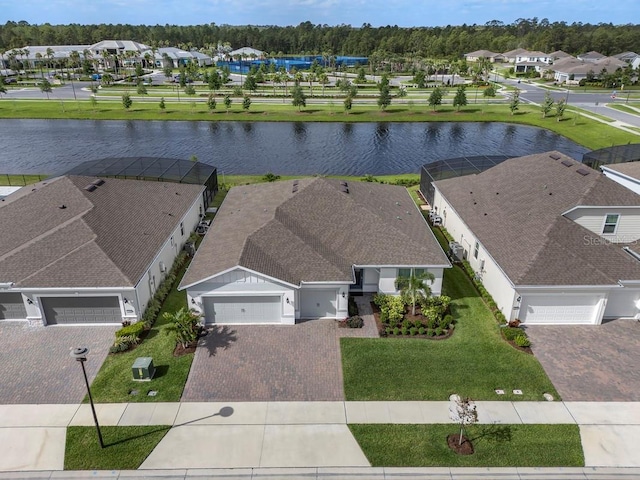 aerial view featuring a residential view and a water view