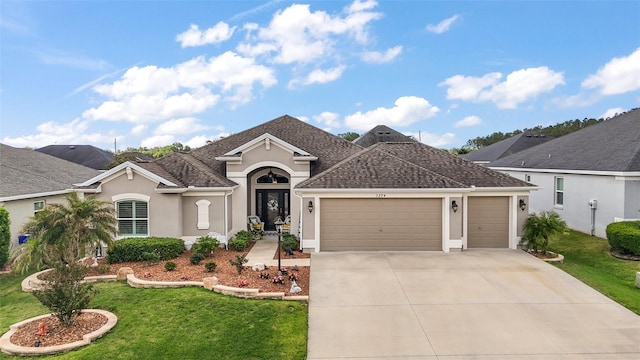 3354 Truluck Pl, Oxford, FL 34484 - view of front of property featuring driveway, an attached garage, a front lawn, and stucco siding