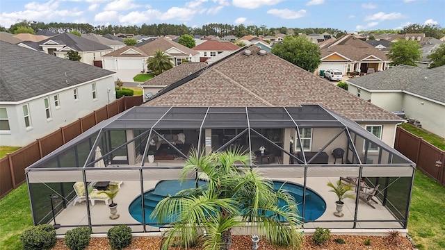 3354 Truluck Pl, Oxford, FL 34484 - pool featuring a fenced backyard, glass enclosure, a residential view, and a patio area