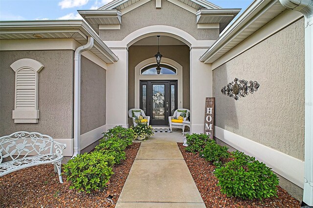 3354 Truluck Pl, Oxford, FL 34484 - view of exterior entry with stucco siding