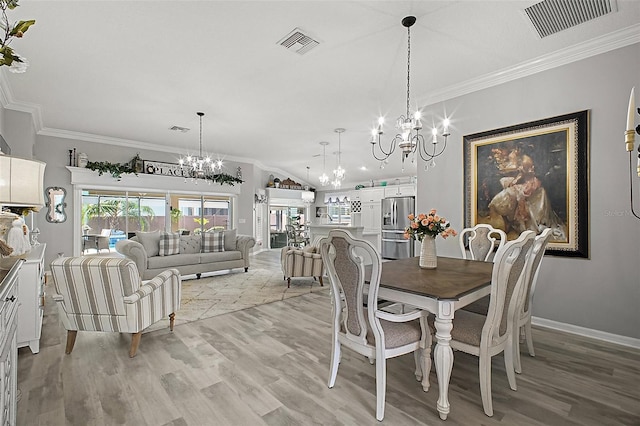 3354 Truluck Pl, Oxford, FL 34484 - dining room featuring visible vents, an inviting chandelier, and crown molding