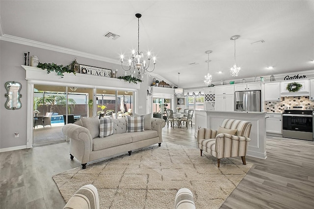 3354 Truluck Pl, Oxford, FL 34484 - living area with lofted ceiling, an inviting chandelier, ornamental molding, light wood finished floors, and visible vents
