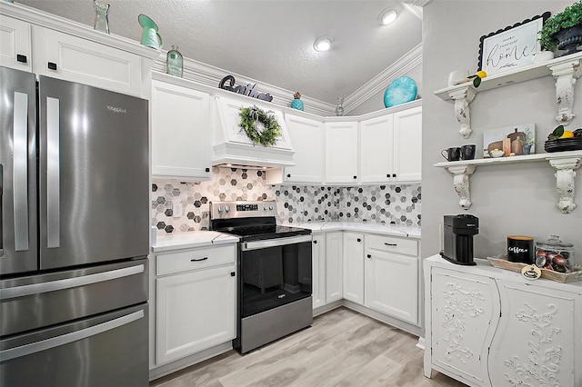 3354 Truluck Pl, Oxford, FL 34484 - kitchen featuring crown molding, light countertops, white cabinetry, appliances with stainless steel finishes, and a textured ceiling