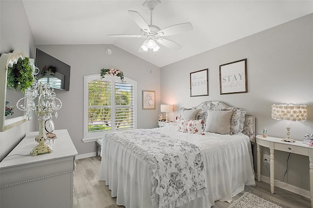 3354 Truluck Pl, Oxford, FL 34484 - bedroom featuring light wood finished floors, baseboards, vaulted ceiling, and a ceiling fan