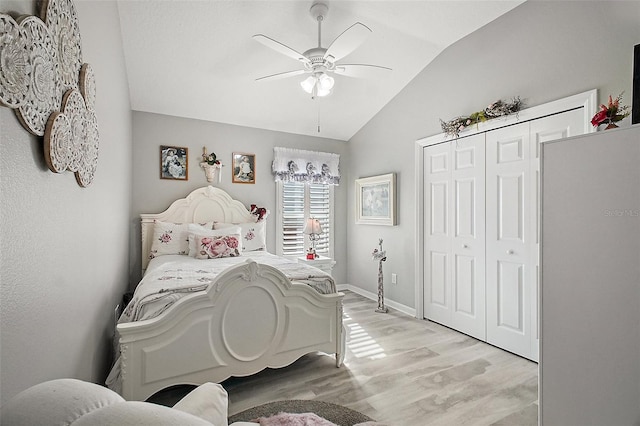 3354 Truluck Pl, Oxford, FL 34484 - bedroom featuring a closet, a ceiling fan, lofted ceiling, light wood-style flooring, and baseboards