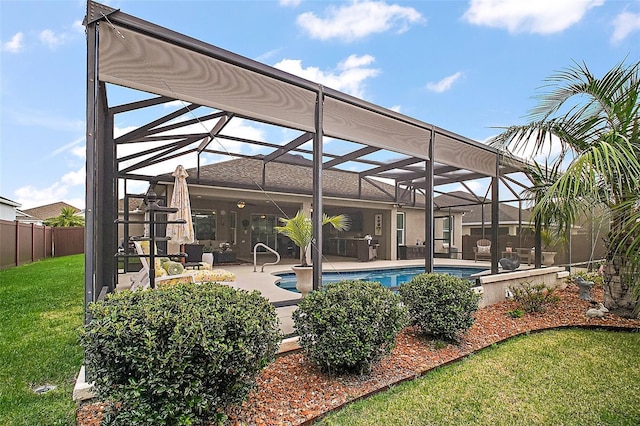 3354 Truluck Pl, Oxford, FL 34484 - outdoor pool with glass enclosure, fence, a patio area, and a yard