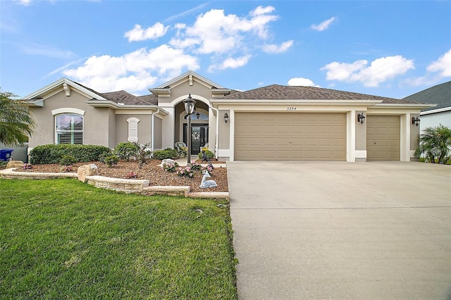 3354 Truluck Pl, Oxford, FL 34484 - view of front of property with driveway, a front yard, a garage, and stucco siding