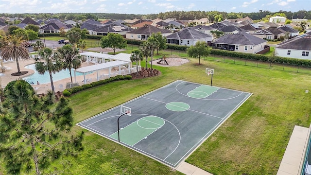3354 Truluck Pl, Oxford, FL 34484 - view of sport court with a residential view, community basketball court, fence, and a yard