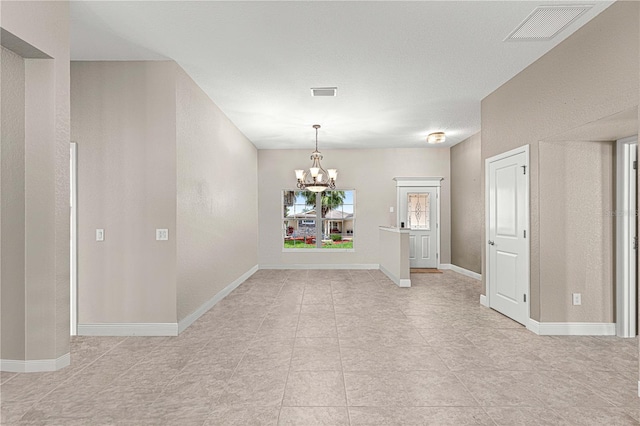 10460 Silver Maple Ave, Oxford, FL 34484 - unfurnished dining area with a chandelier, light tile patterned floors, and baseboards
