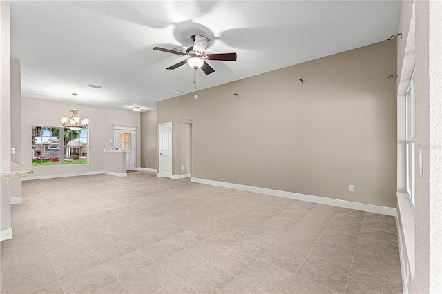 10460 Silver Maple Ave, Oxford, FL 34484 - unfurnished living room with a ceiling fan, a chandelier, and baseboards